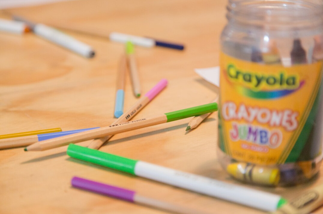 Hand-drawn storyboard frames and pencils spread on a table