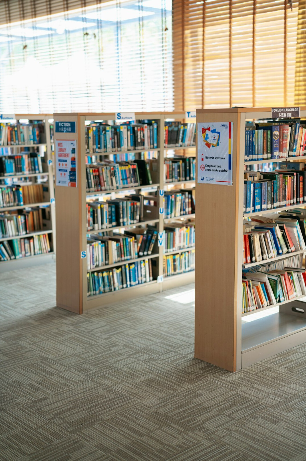 Shelves of archived advertising posters and magazines in a library